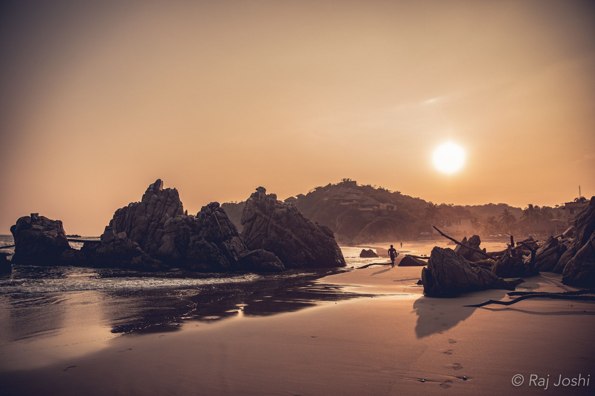Sea stacks catching the last warm light on a Pacific beach at sunset